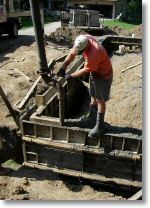 pouring the concrete into the forms