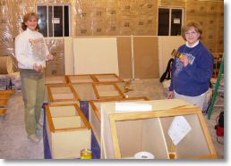 Mom and I sealing and staining the wall cabinets